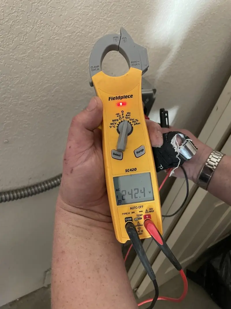 Voltage testing with clamp meter during Electrical Installation Services in South Huntingdon